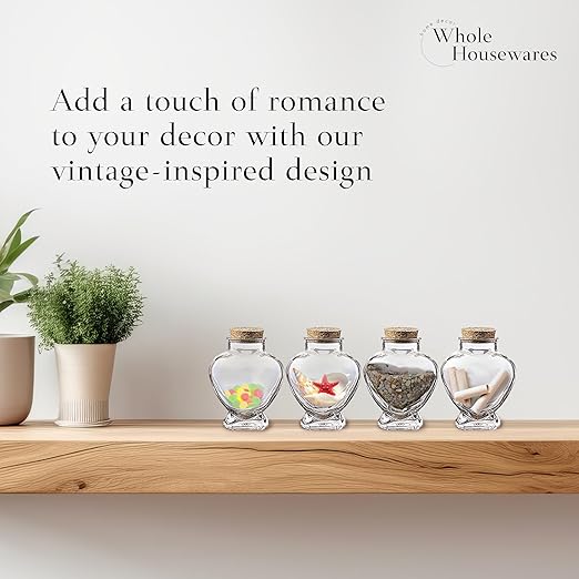 Set of 12 Heart Shaped Glass Jars with Cork Lids by WHOLE HOUSEWARES - Mini Bottles with String and Heart Labels - Small Spell Jars for Wedding Favors, Keepsakes, Potions and Valentine's Day Gifts